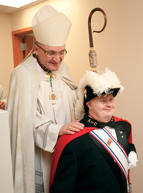Bishop Zubik with a young Knight